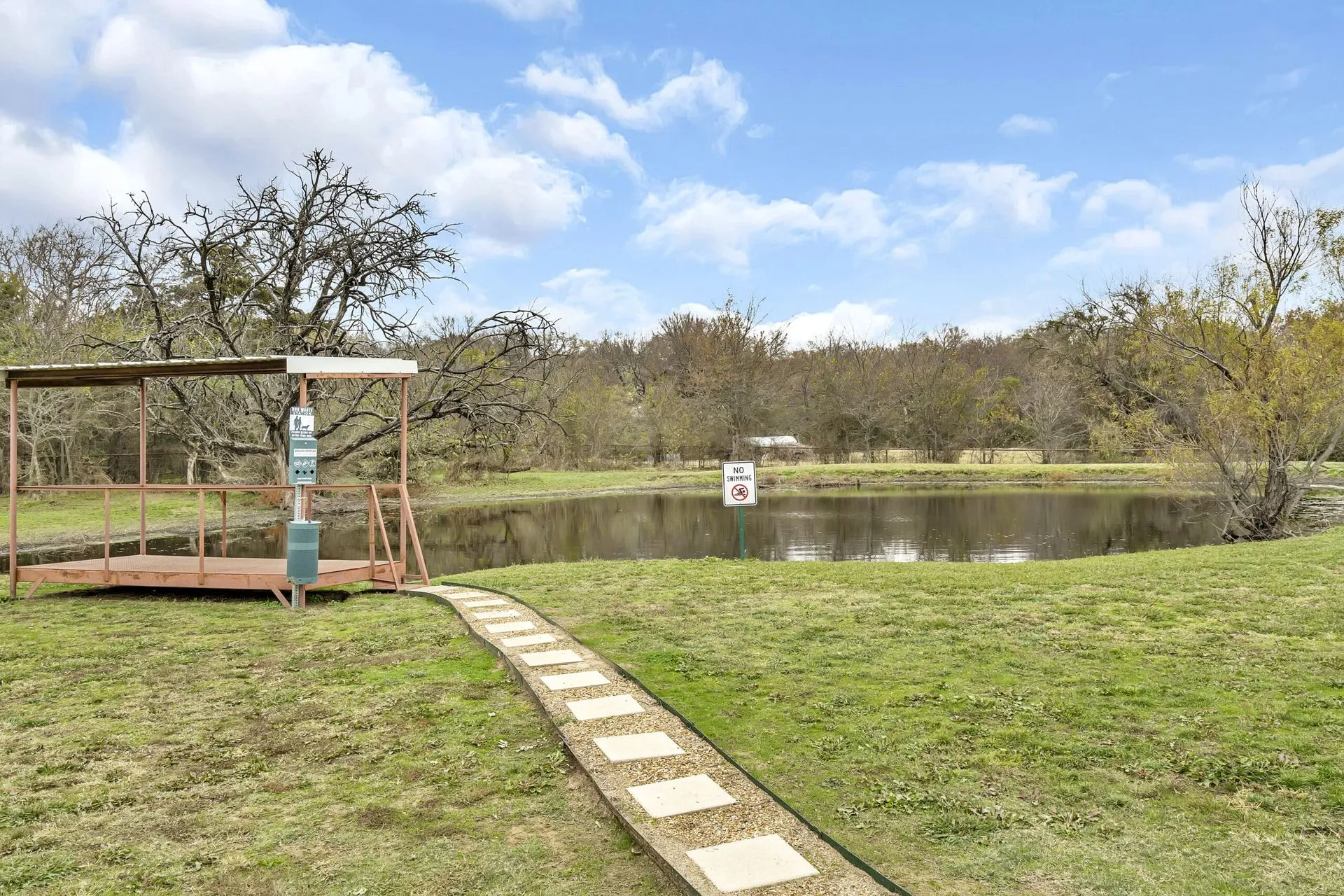 The dedicated dog swimming pond at Waggin' Tail Ranch RV Resort in Pilot Point, TX