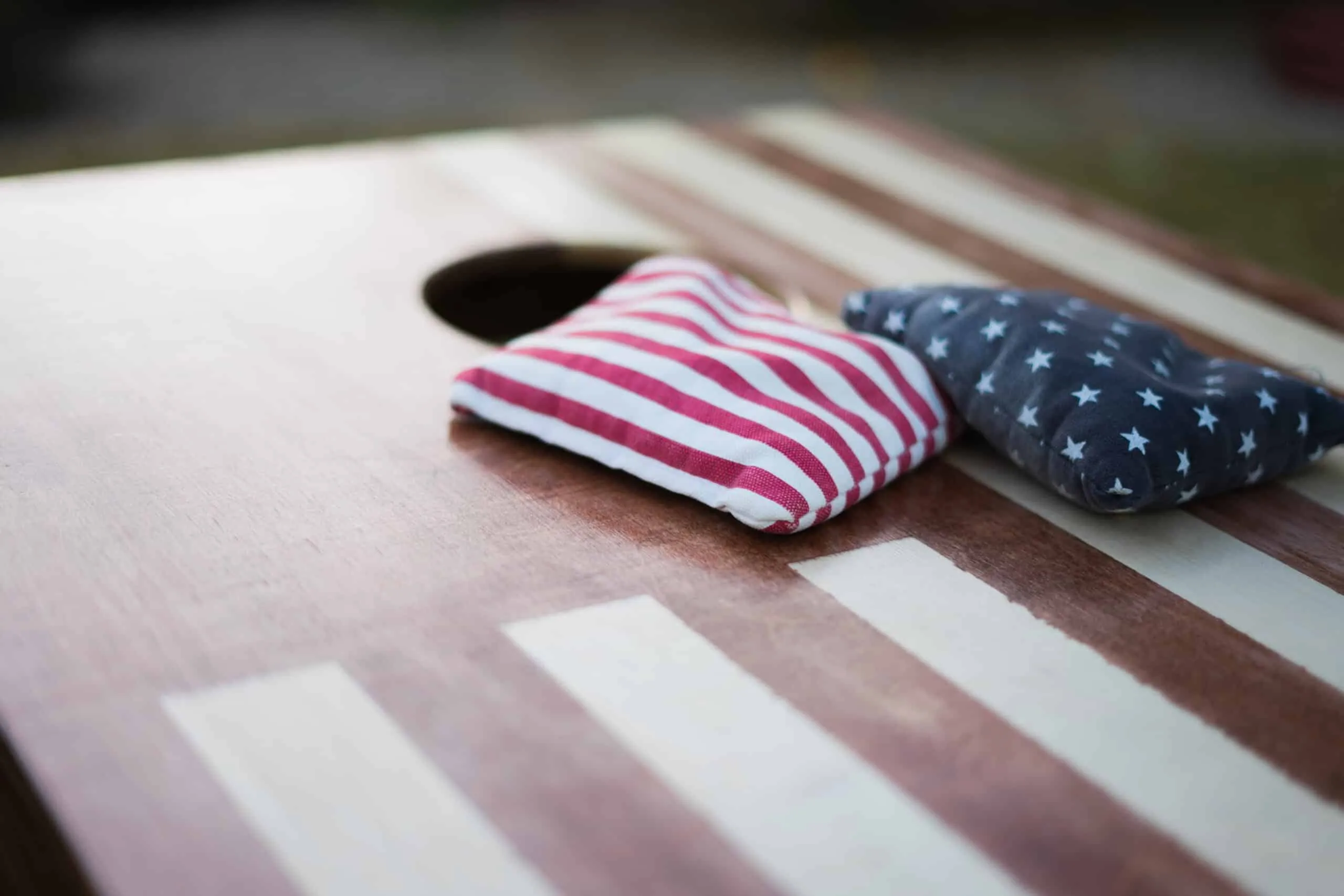 Cornhole and outdoor lawn games at the pavilion at Waggin' Tail Ranch RV Resort, Pilot Point, TX