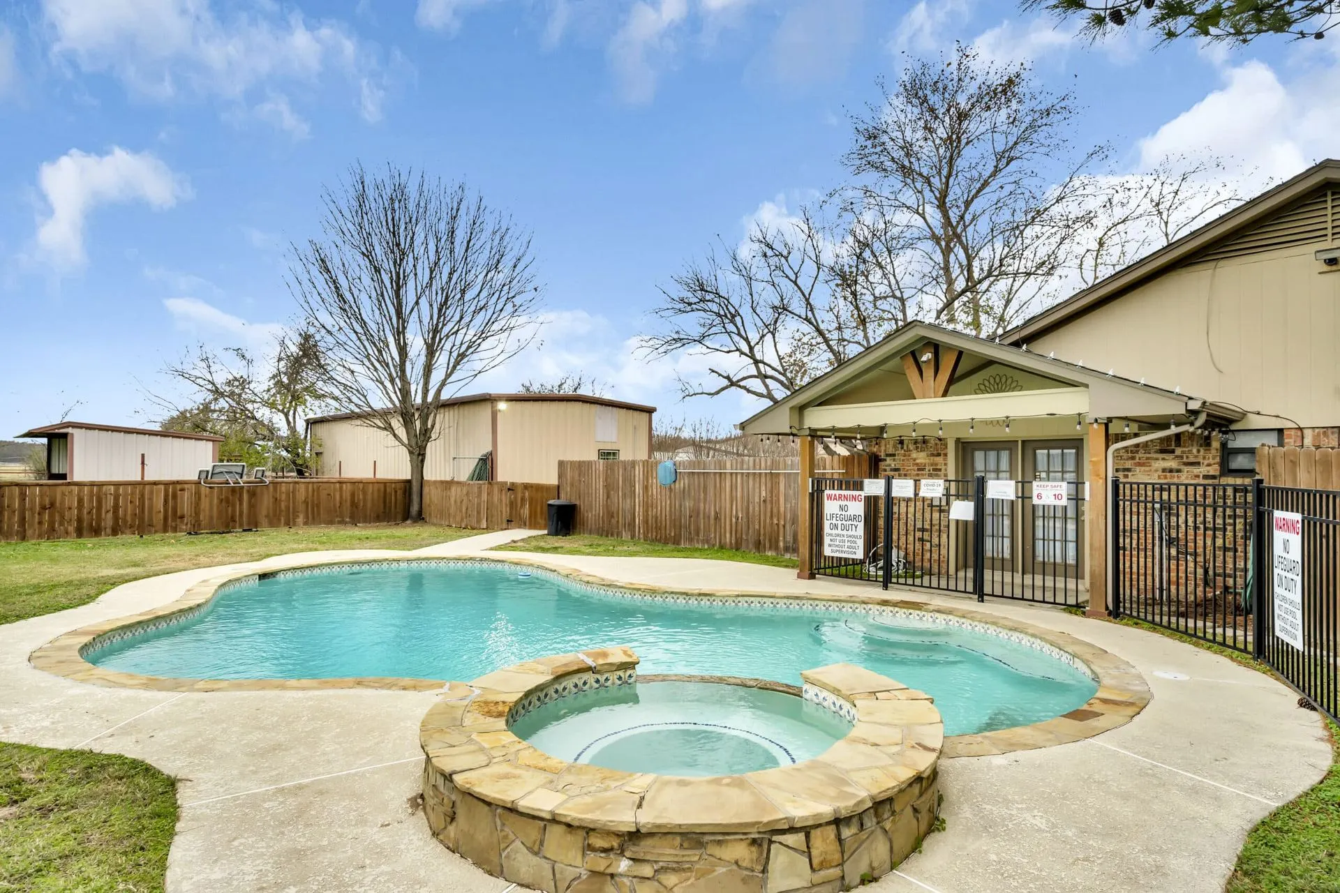 The outdoor pool at Waggin' Tail Ranch RV Resort in Pilot Point, TX, open dawn to dusk