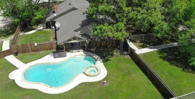 Overhead aerial view of the pool at Waggin' Tail Ranch RV Resort, Pilot Point, TX