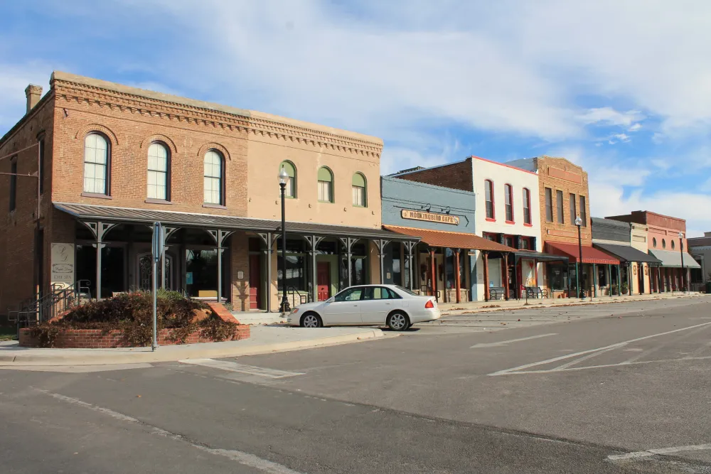 Historic brick storefronts on the Pilot Point square