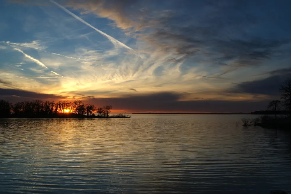 Sunset over Lake Ray Roberts, the reservoir that flooded the old Denton County farmland north of Pilot Point