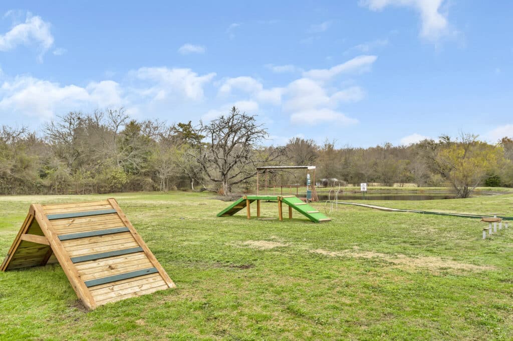 Image of the dog park and agility equipment at Waggin' Tail RV Resort