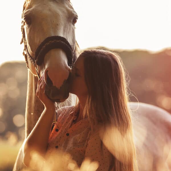 Woman Kissing Her Horse - Outdoor Scene in Fall